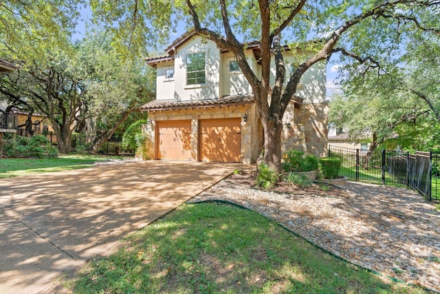 mediterranean / spanish-style house with a garage