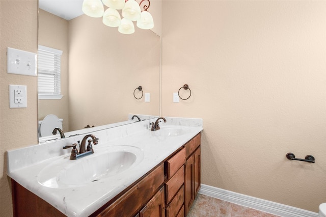 bathroom with double vanity and tile flooring