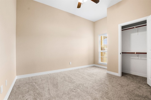 unfurnished bedroom with ceiling fan, a closet, and light carpet