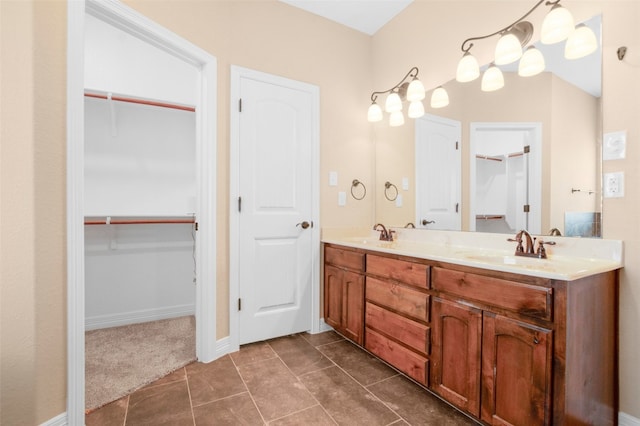 bathroom with tile flooring and double vanity