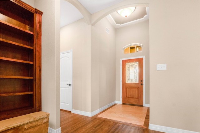 foyer featuring light tile floors