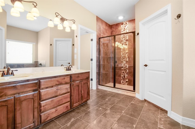 bathroom with tile flooring, a shower with door, and dual bowl vanity