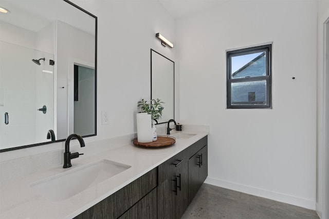 bathroom with vanity, concrete floors, and a shower with shower door