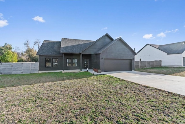 view of front of house with a front lawn and a garage