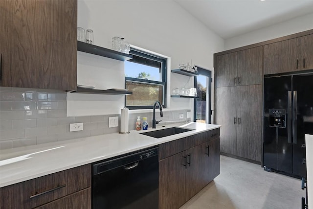 kitchen with decorative backsplash, dark brown cabinets, sink, and black appliances