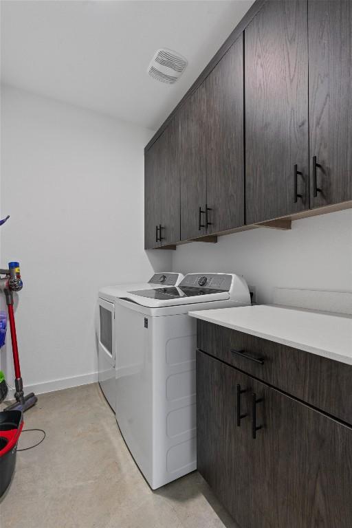 laundry area with cabinets and washer and dryer