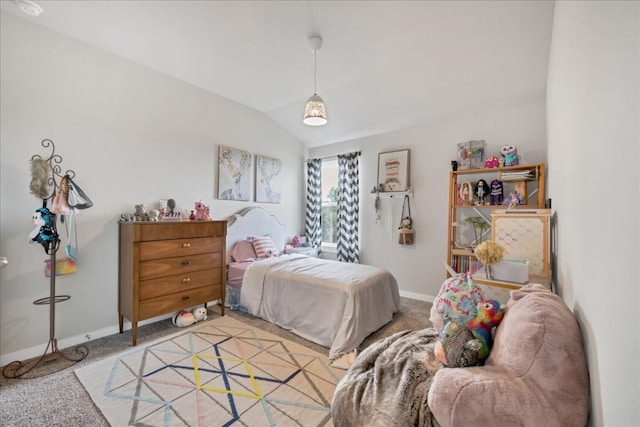 bedroom featuring vaulted ceiling and light colored carpet