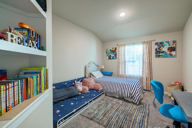 carpeted bedroom with lofted ceiling