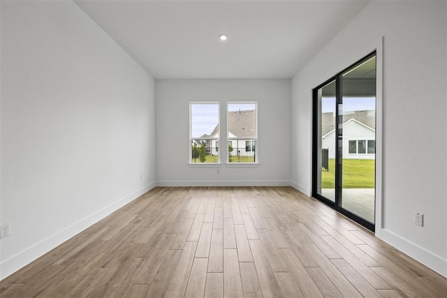 empty room with light wood-type flooring