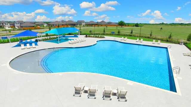 view of pool featuring a patio area