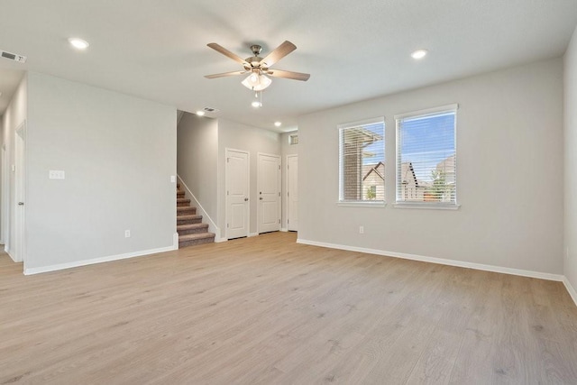 empty room featuring light hardwood / wood-style flooring and ceiling fan