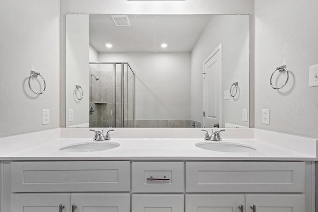 bathroom featuring vanity and walk in shower