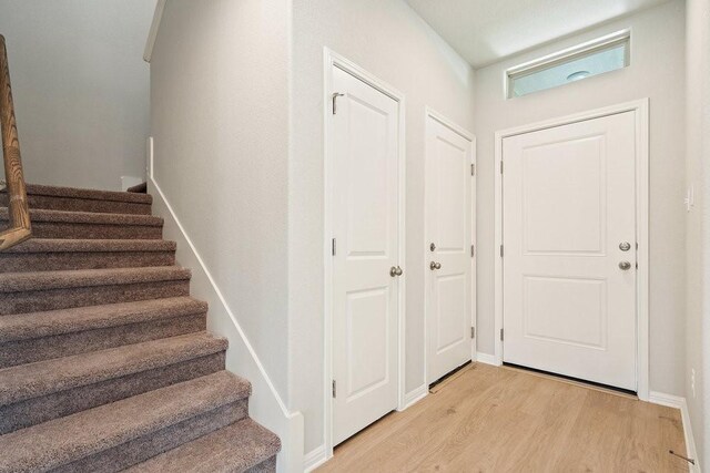 entrance foyer with light hardwood / wood-style floors