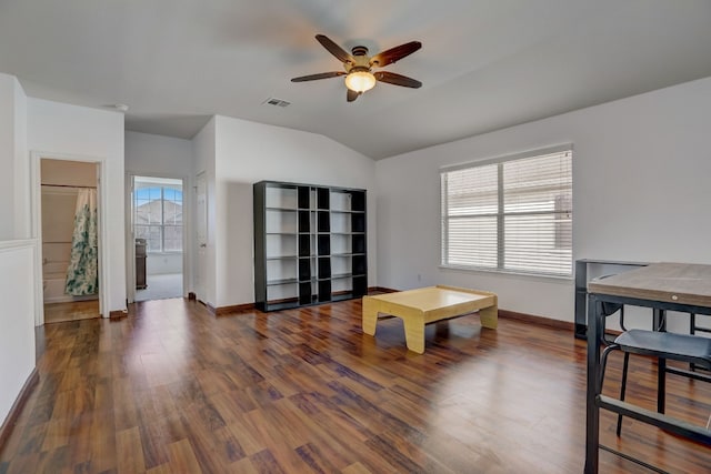 playroom with a wealth of natural light, visible vents, vaulted ceiling, and wood finished floors