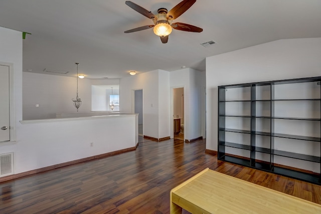 living area featuring visible vents, ceiling fan, baseboards, and wood finished floors