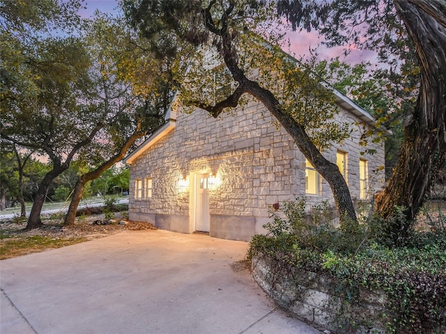 view of property exterior at dusk