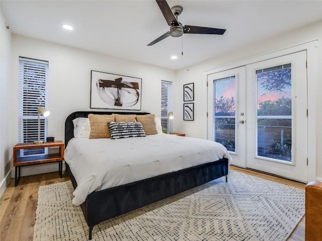 bedroom with ceiling fan, light hardwood / wood-style flooring, access to exterior, and french doors