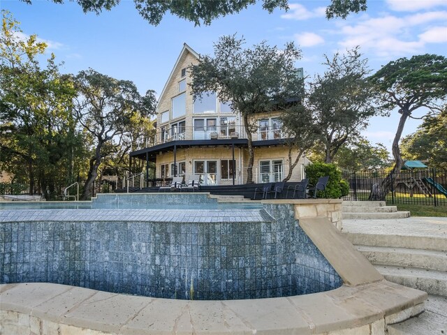 view of home's community featuring a swimming pool and a playground