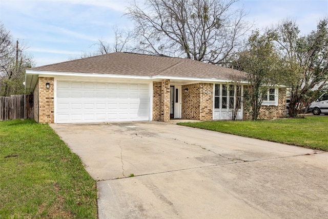 ranch-style home featuring a front yard and a garage