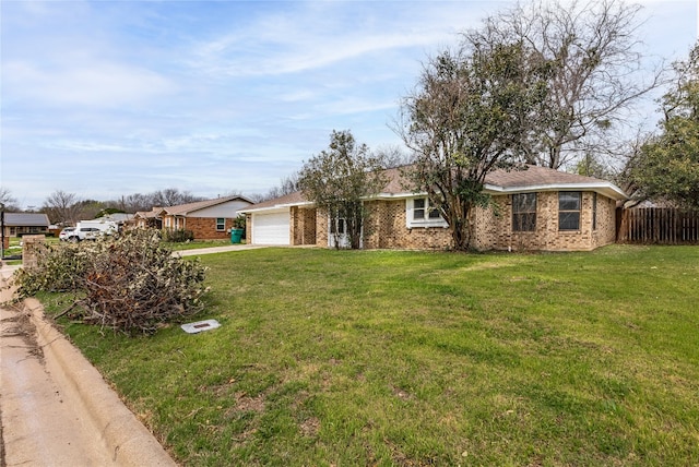 ranch-style house featuring a front lawn and a garage