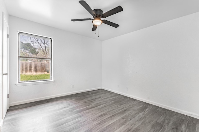 unfurnished room featuring dark hardwood / wood-style flooring and ceiling fan