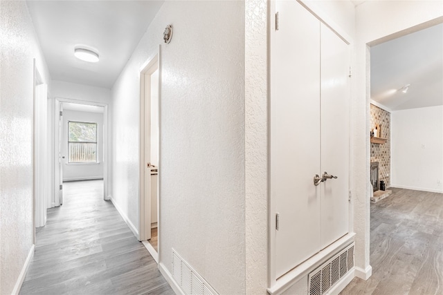 corridor featuring light wood-type flooring