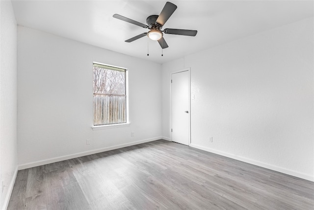 empty room featuring light hardwood / wood-style floors and ceiling fan