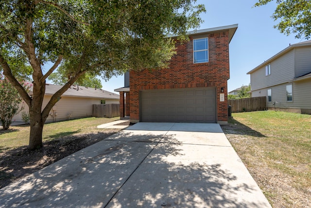 view of front facade with a front yard and a garage