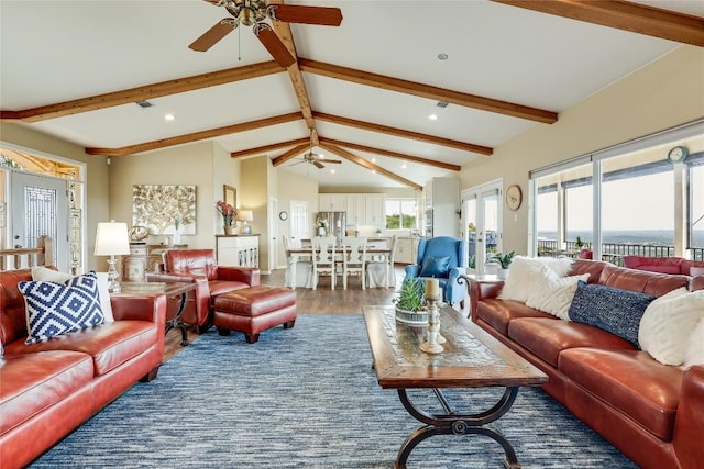 living room with vaulted ceiling with beams, ceiling fan, and dark wood-style floors