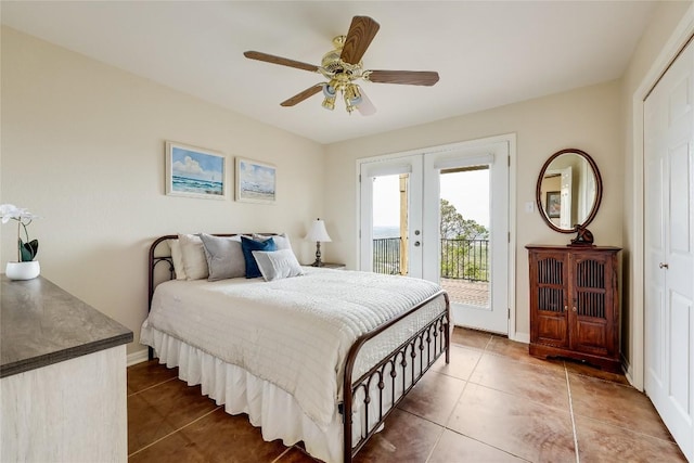 bedroom with a ceiling fan, access to outside, french doors, a closet, and tile patterned floors