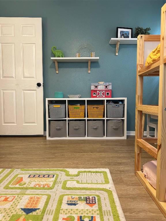 recreation room featuring hardwood / wood-style flooring