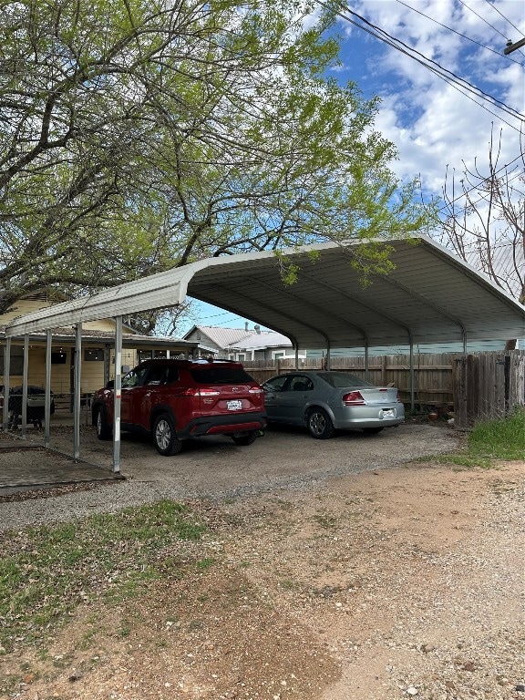 view of parking / parking lot with a carport