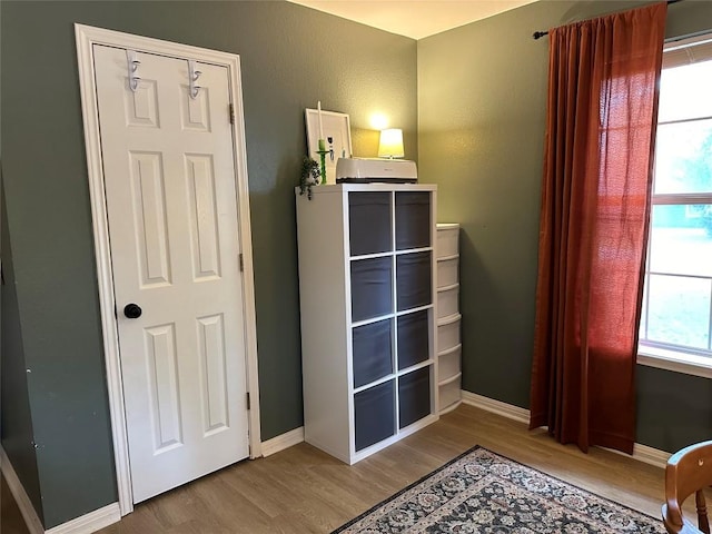 1301 NE 2nd St, Smithville, TX 78957 - bedroom featuring baseboards and wood finished floors