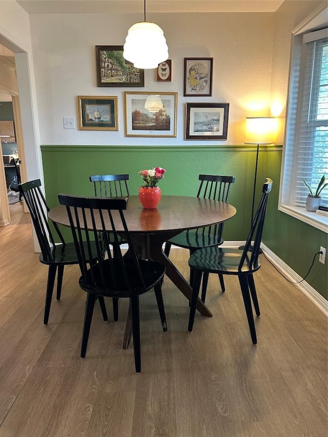 1301 NE 2nd St, Smithville, TX 78957 - dining area featuring baseboards and wood finished floors