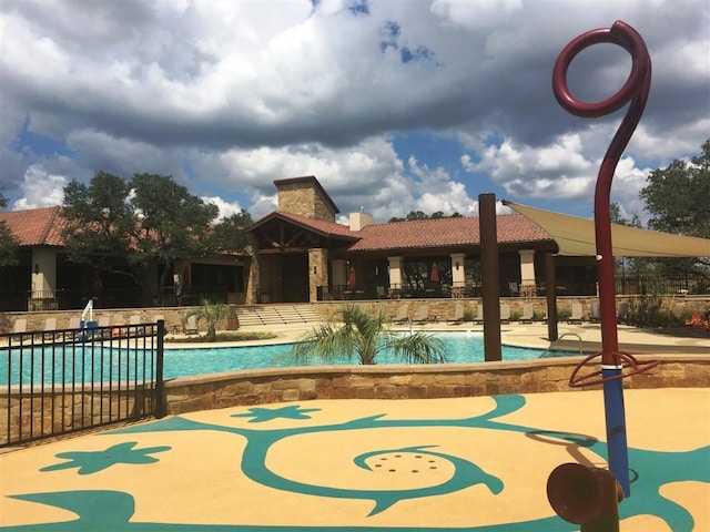 view of swimming pool with a patio area