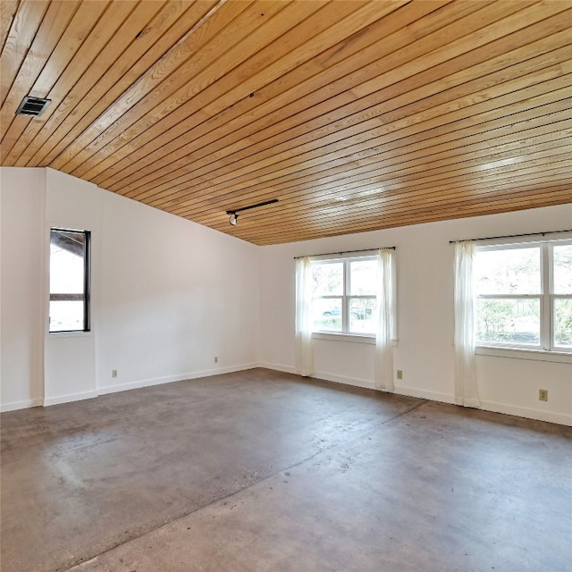 unfurnished room featuring lofted ceiling, wooden ceiling, and concrete flooring