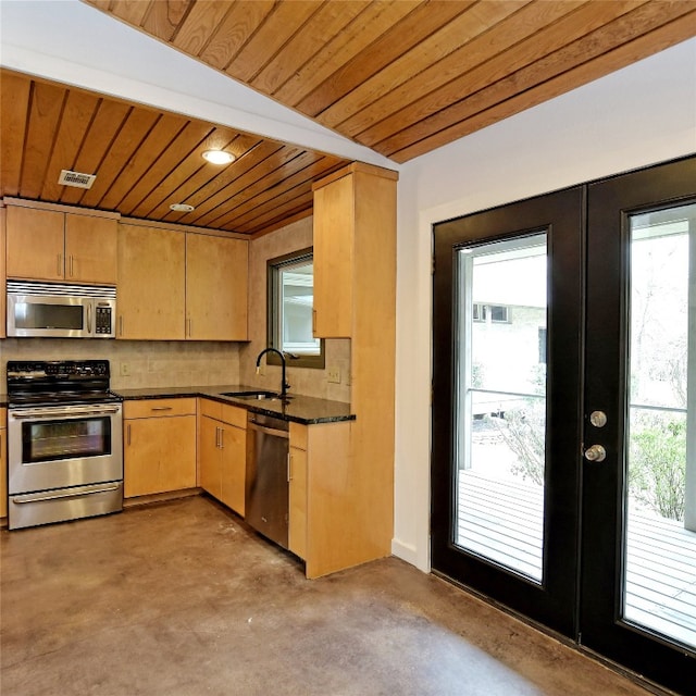 kitchen with wood ceiling, stainless steel appliances, and a wealth of natural light