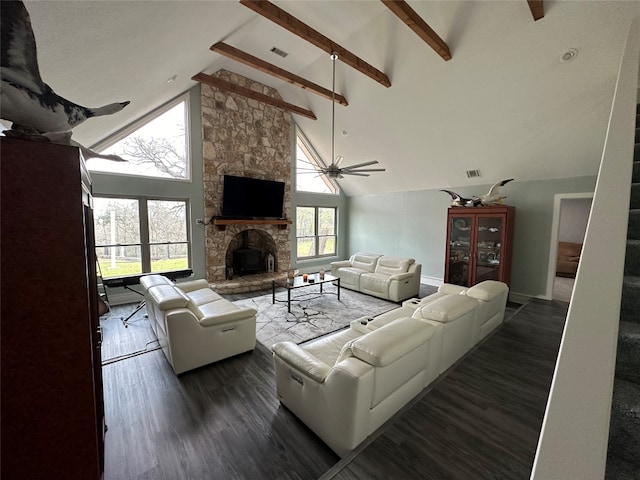 living room with a stone fireplace, dark wood-type flooring, high vaulted ceiling, and beamed ceiling