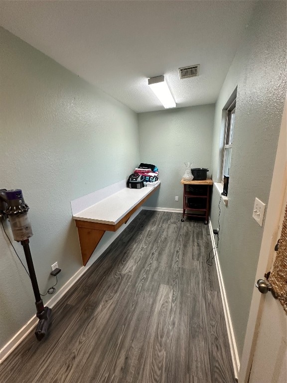 interior space with dark hardwood / wood-style floors