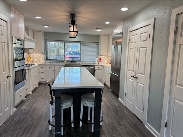 kitchen featuring tasteful backsplash, stainless steel appliances, and dark hardwood / wood-style floors