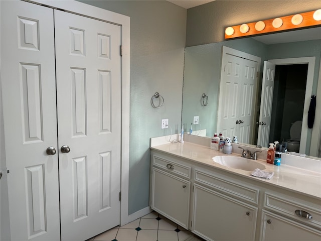 bathroom with large vanity and tile floors