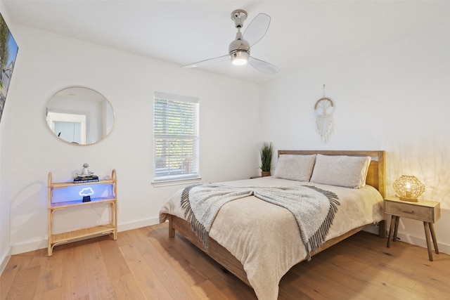 bedroom with hardwood / wood-style flooring and ceiling fan