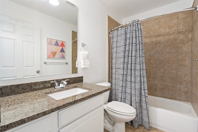 full bathroom with vanity, shower / bath combo, and toilet