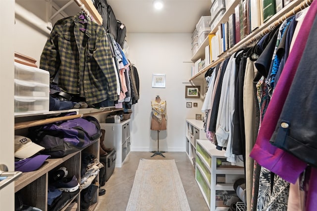 walk in closet featuring light tile floors