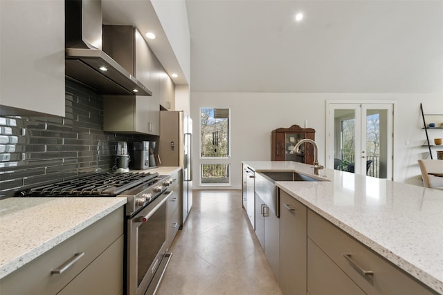 kitchen featuring stainless steel appliances, light tile floors, french doors, wall chimney exhaust hood, and light stone counters