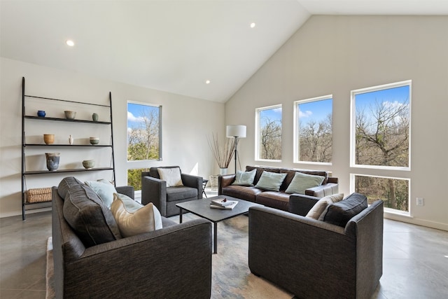 living room with a wealth of natural light and high vaulted ceiling