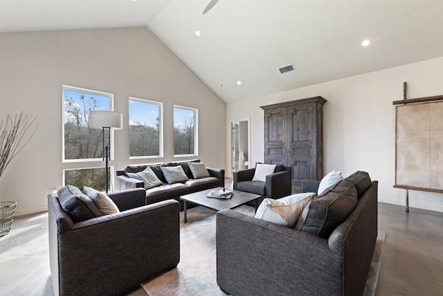 living room with high vaulted ceiling