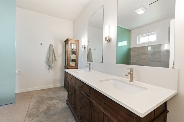 bathroom with dual bowl vanity and tile floors