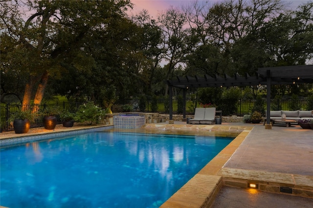 pool at dusk with a pergola, a patio, a hot tub, and an outdoor living space