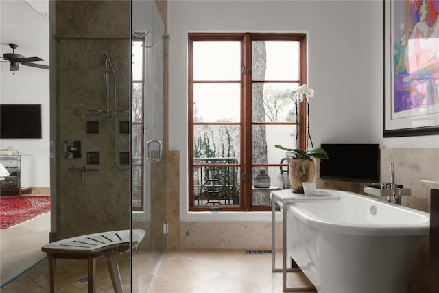 bathroom featuring shower with separate bathtub, ceiling fan, and tile flooring